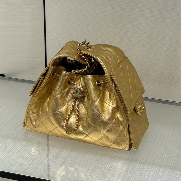 CHANEL Handbags - CHANEL 25 small Metallic Gold Quilted Drawstring Shoulder Bag